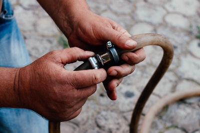 Close-up of man holding hands