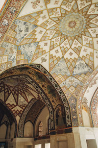 Low angle view of ornate ceiling in historic building