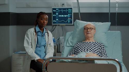 Portrait of female doctor standing in hospital