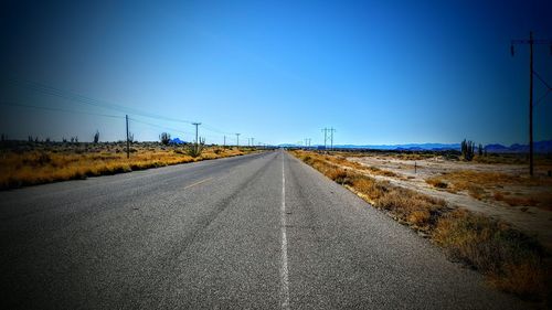 Empty road along landscape