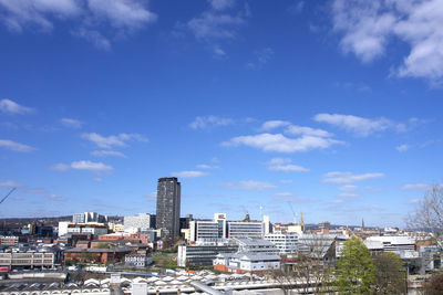 High angle view of sheffield buildings against blue sky