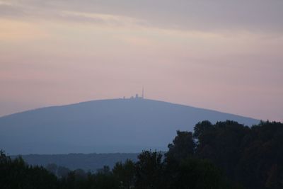 Scenic view of silhouette mountains against sky during sunset