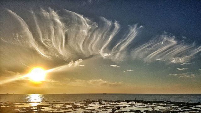 sea, horizon over water, water, sun, scenics, tranquil scene, beauty in nature, sky, tranquility, sunset, sunbeam, nature, idyllic, sunlight, reflection, beach, cloud - sky, waterfront, cloud, outdoors