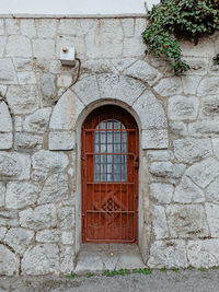 Low angle view of window on wall of building