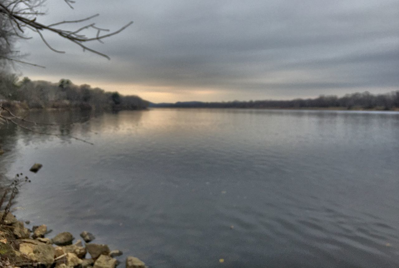 water, tranquil scene, tranquility, sky, lake, scenics, beauty in nature, reflection, tree, nature, cloud - sky, idyllic, cloud, cloudy, calm, non-urban scene, lakeshore, outdoors, waterfront, river