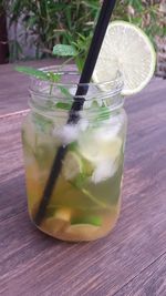 Close-up of refreshing drink in jar on table