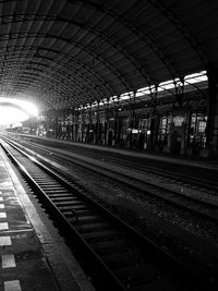 Train at railroad station against sky