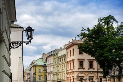 Low angle view of residential buildings against cloudy sky