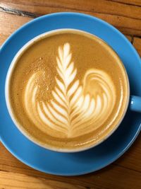 High angle view of cappuccino on table