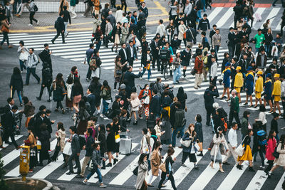 High angle view of people crossing road