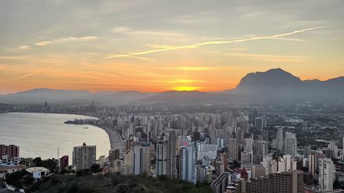 High angle view of cityscape against sky during sunset