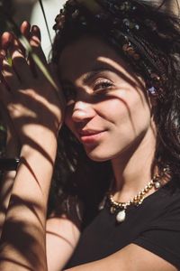 Close-up portrait of smiling young woman