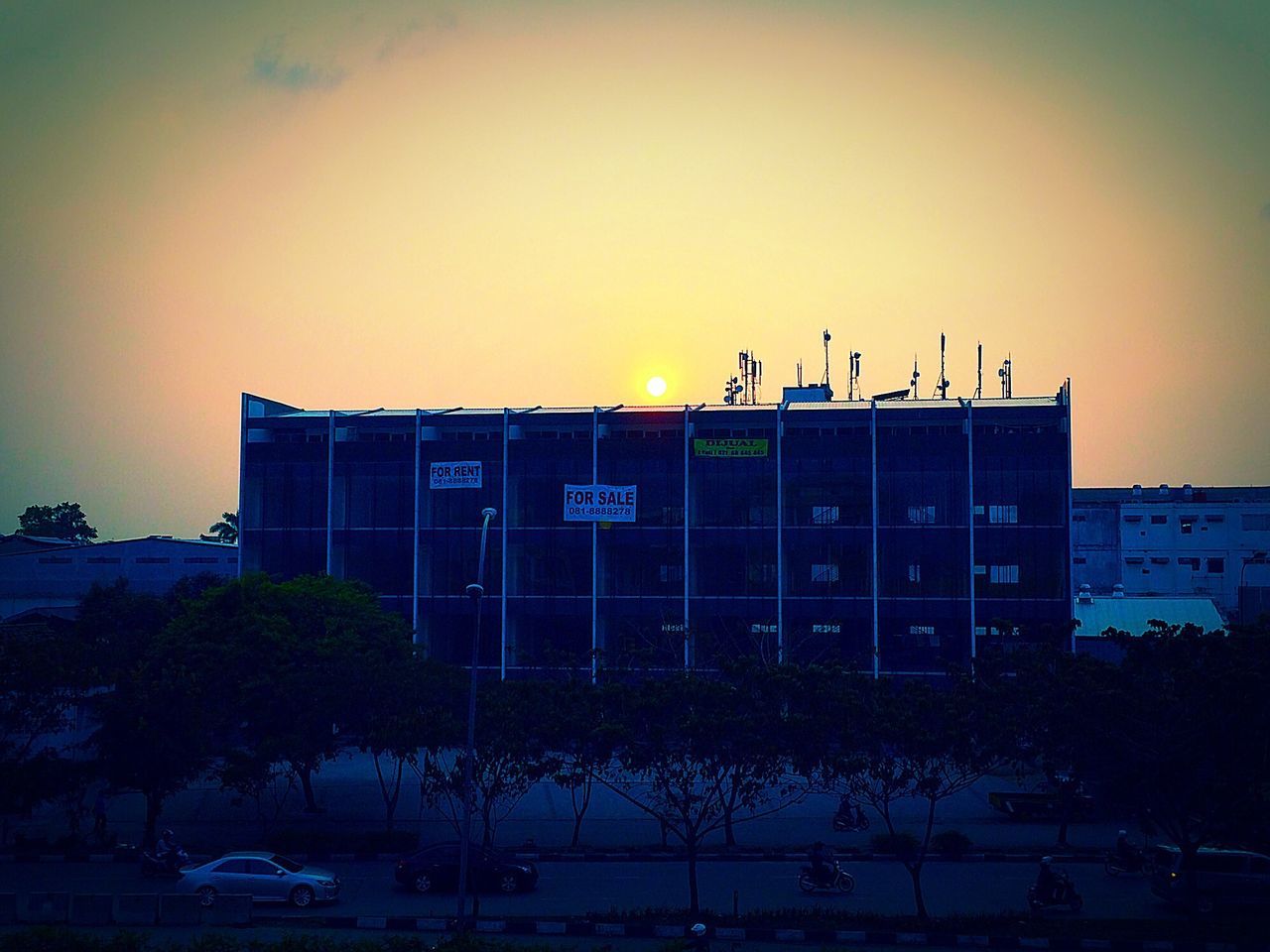 sunset, building exterior, architecture, built structure, orange color, clear sky, copy space, sky, transportation, outdoors, dusk, silhouette, no people, communication, nature, text, mode of transport, western script, city, auto post production filter