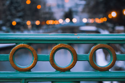 Close-up of illuminated railing