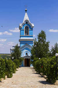 View of bell tower against blue sky