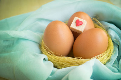 High angle view of eggs in basket