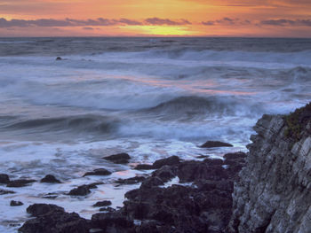 Scenic view of sea against dramatic sky