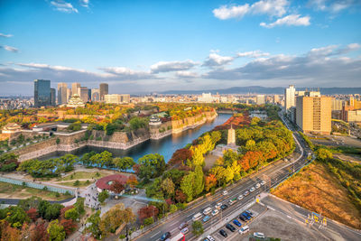 High angle view of city buildings against sky