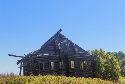 Low angle view of built structure against clear blue sky