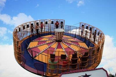 Low angle view of ferris wheel against sky