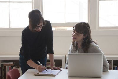 Businesswomen working together in new office