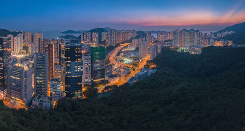 High angle view of city lit up at night