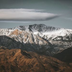 Scenic view of mountains against sky during winter