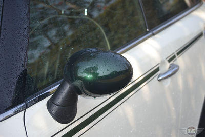 Close-up of vintage car on side-view mirror