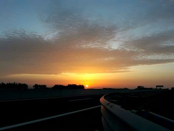 Road against sky during sunset