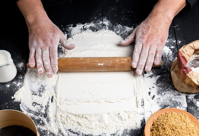 Cropped hands of chef preparing food