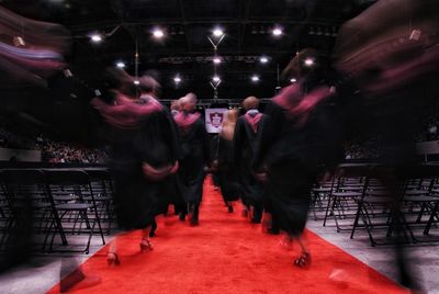 Blurred motion of woman at night