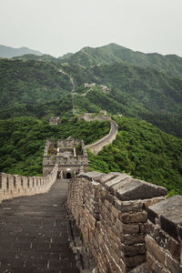 Old ruins on mountain against sky