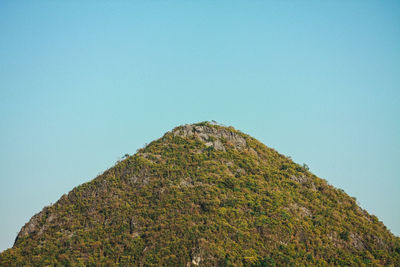 Low angle view of mountain against clear blue sky