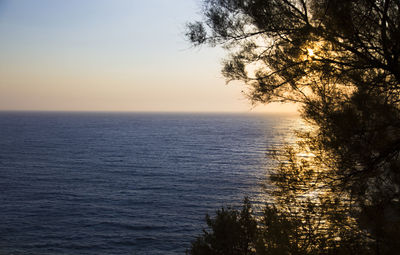 Scenic view of sea against sky at sunset