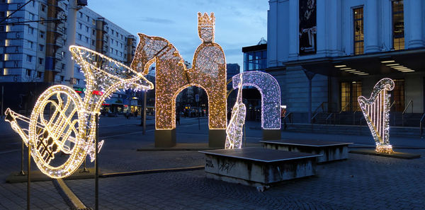 Illuminated building in city at night