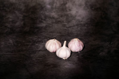 Close-up of garlic on white background