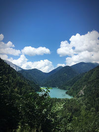 Scenic view of lake and mountains against sky