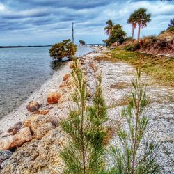 Scenic view of sea against cloudy sky