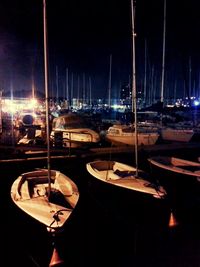 Sailboats in sea at night