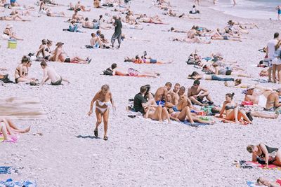 Group of people sitting on sand