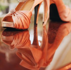 Close-up of shoes in a mirror.