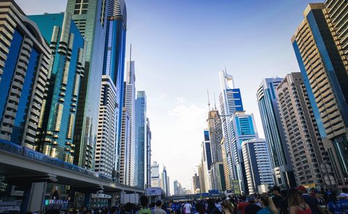 Low angle view of modern buildings against sky in city