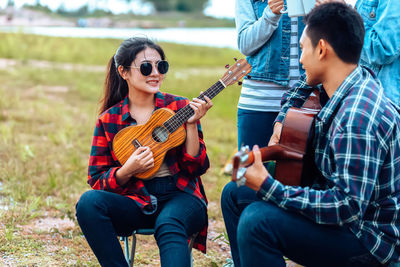 Young woman playing guitar