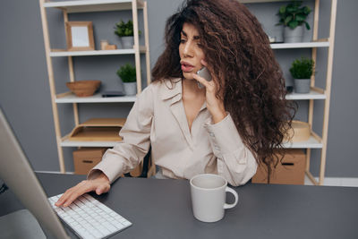 Young woman using mobile phone