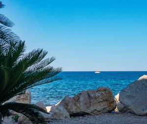 Scenic view of sea against clear blue sky