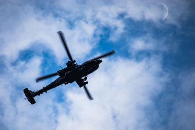 Low angle view of airplane flying against sky