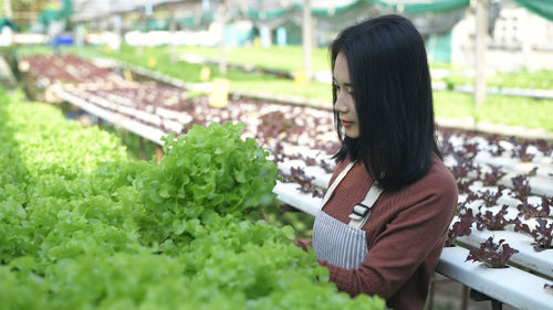 Midsection of woman standing at store