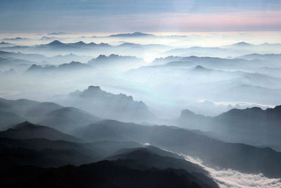 Scenic view of mountains in foggy weather