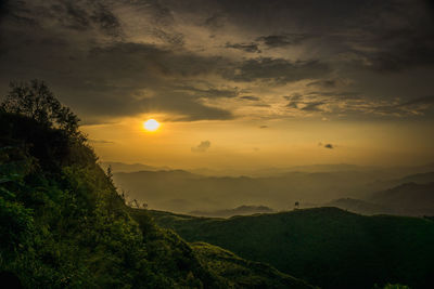 Scenic view of landscape against sky during sunset