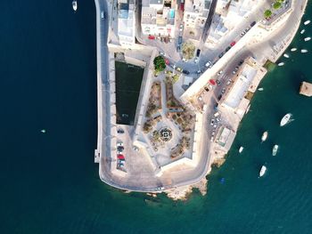 Aerial view of city by sea